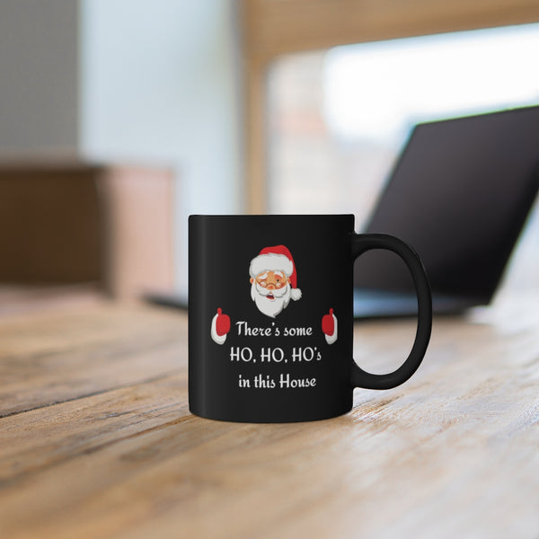 There’s some Ho Ho Ho’s in this House Black mug (11oz)